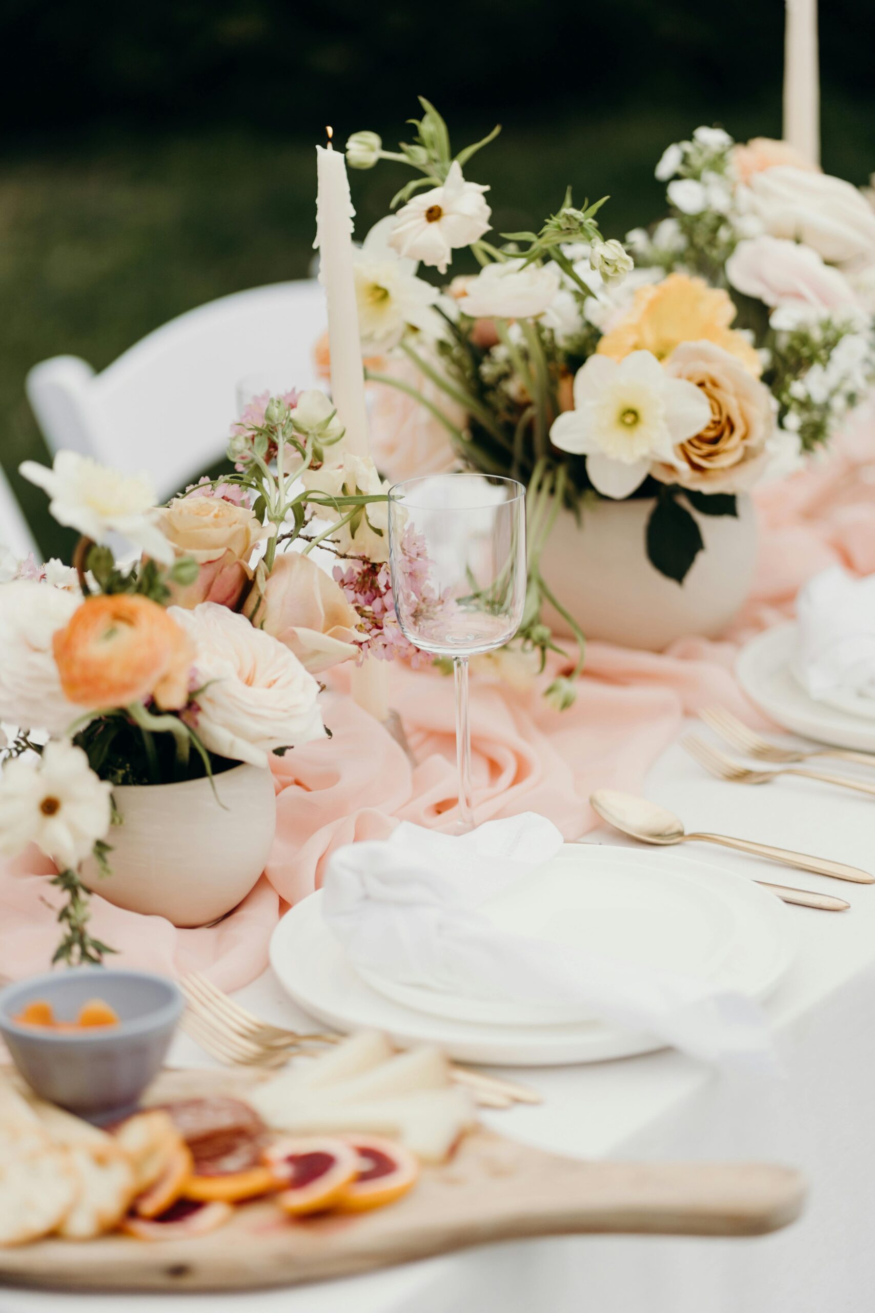 white and peach table decor and flowers